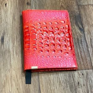 Brahmin notebook cover. Red orange color